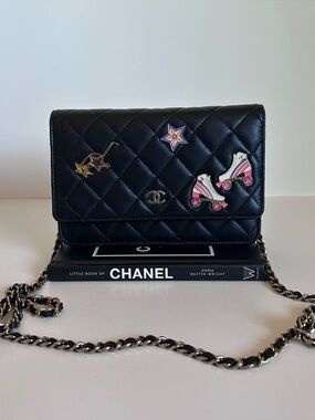 CHANEL Black Quilted Leather Crossbody with Playful Pin Accents
